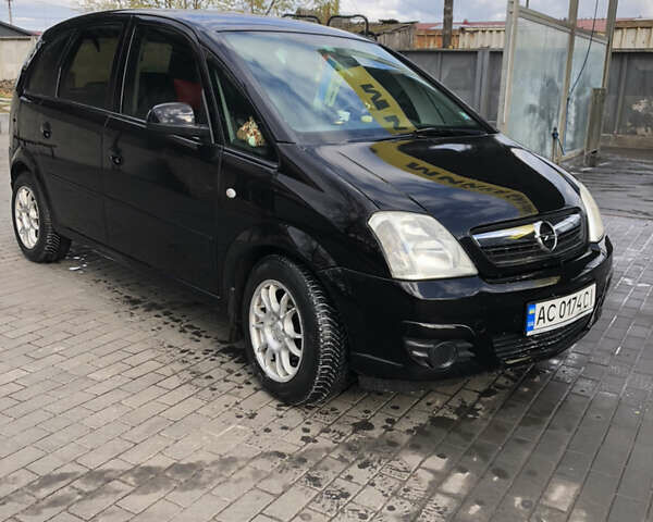 Черный Опель Мерива, объемом двигателя 1.25 л и пробегом 197 тыс. км за 3650 $, фото 5 на Automoto.ua