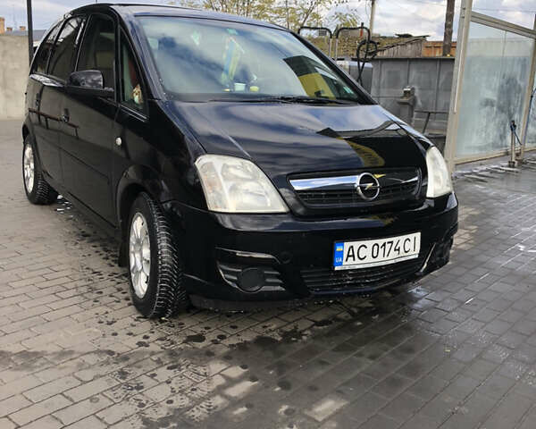 Черный Опель Мерива, объемом двигателя 1.25 л и пробегом 197 тыс. км за 3650 $, фото 3 на Automoto.ua