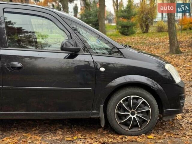 Черный Опель Мерива, объемом двигателя 1.6 л и пробегом 262 тыс. км за 4100 $, фото 8 на Automoto.ua