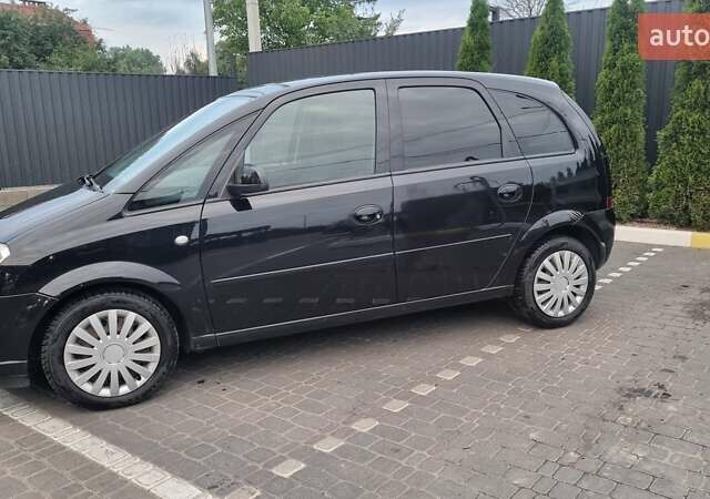 Черный Опель Мерива, объемом двигателя 1.6 л и пробегом 212 тыс. км за 4900 $, фото 2 на Automoto.ua