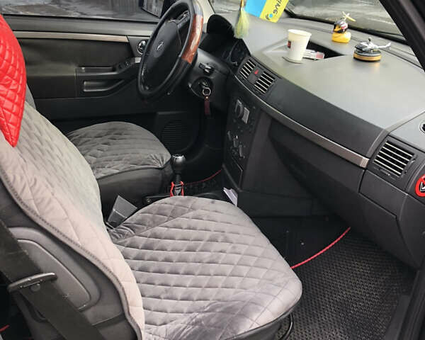 Черный Опель Мерива, объемом двигателя 1.25 л и пробегом 197 тыс. км за 3650 $, фото 6 на Automoto.ua