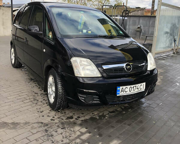 Черный Опель Мерива, объемом двигателя 1.25 л и пробегом 197 тыс. км за 3650 $, фото 1 на Automoto.ua