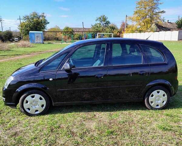 Черный Опель Мерива, объемом двигателя 1.36 л и пробегом 184 тыс. км за 5000 $, фото 1 на Automoto.ua