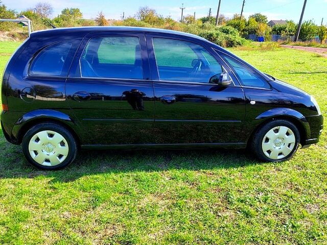 Черный Опель Мерива, объемом двигателя 1.4 л и пробегом 184 тыс. км за 5000 $, фото 4 на Automoto.ua