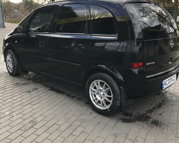 Черный Опель Мерива, объемом двигателя 1.25 л и пробегом 197 тыс. км за 3650 $, фото 11 на Automoto.ua