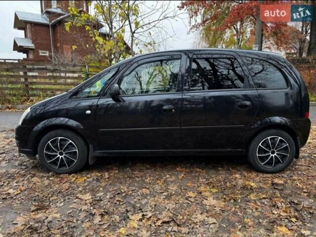 Черный Опель Мерива, объемом двигателя 1.6 л и пробегом 262 тыс. км за 4100 $, фото 5 на Automoto.ua