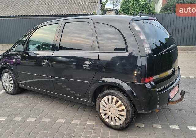 Черный Опель Мерива, объемом двигателя 1.6 л и пробегом 212 тыс. км за 4900 $, фото 3 на Automoto.ua