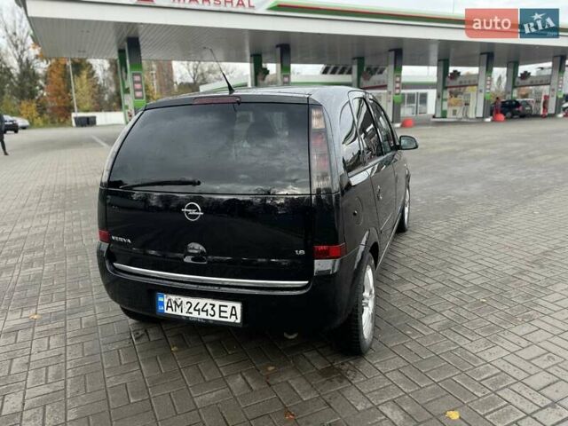 Черный Опель Мерива, объемом двигателя 1.6 л и пробегом 149 тыс. км за 4150 $, фото 5 на Automoto.ua