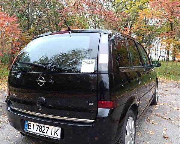 Черный Опель Мерива, объемом двигателя 1.6 л и пробегом 150 тыс. км за 5400 $, фото 5 на Automoto.ua