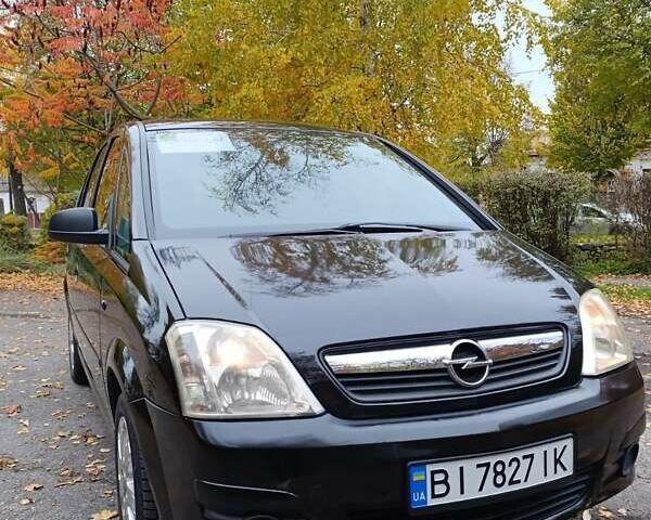 Черный Опель Мерива, объемом двигателя 1.6 л и пробегом 150 тыс. км за 5400 $, фото 10 на Automoto.ua