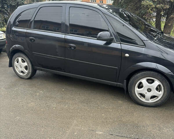 Черный Опель Мерива, объемом двигателя 1.6 л и пробегом 158 тыс. км за 4500 $, фото 11 на Automoto.ua