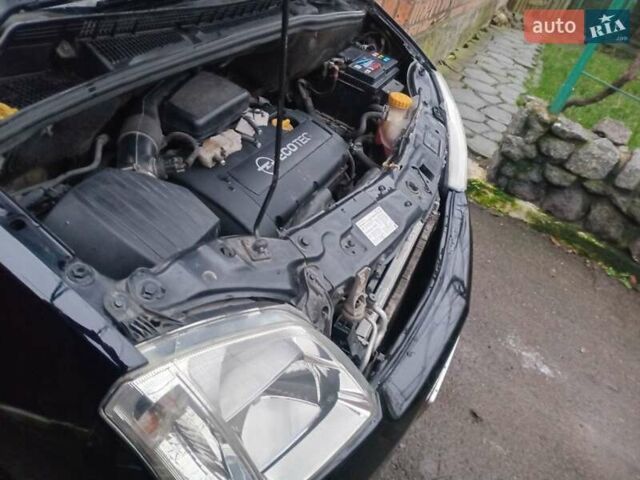 Черный Опель Мерива, объемом двигателя 1.6 л и пробегом 145 тыс. км за 3850 $, фото 19 на Automoto.ua