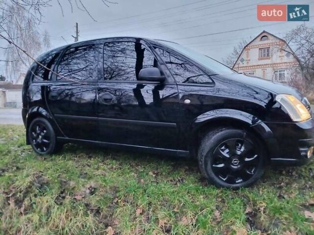 Черный Опель Мерива, объемом двигателя 1.6 л и пробегом 145 тыс. км за 3850 $, фото 6 на Automoto.ua