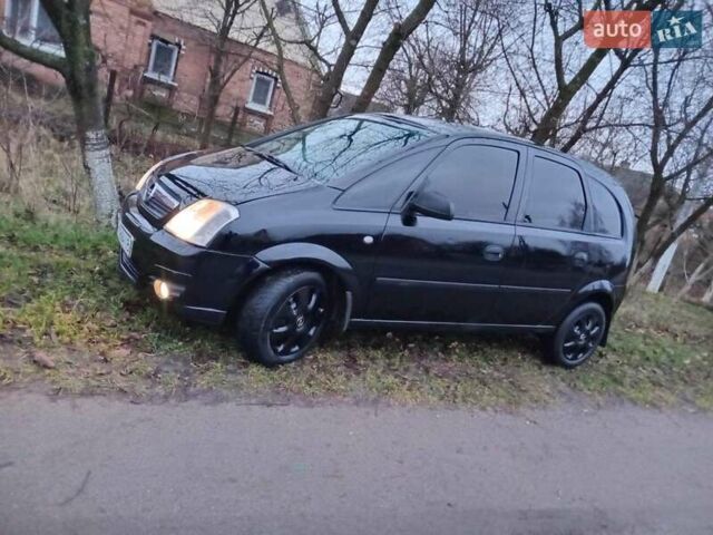 Черный Опель Мерива, объемом двигателя 1.6 л и пробегом 145 тыс. км за 3850 $, фото 2 на Automoto.ua