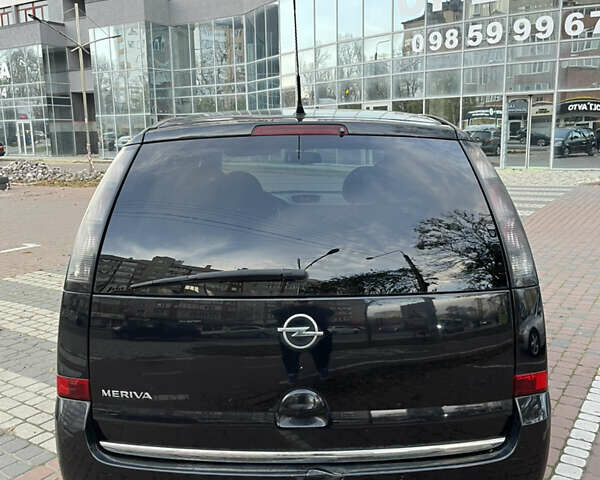 Черный Опель Мерива, объемом двигателя 1.6 л и пробегом 255 тыс. км за 4199 $, фото 7 на Automoto.ua