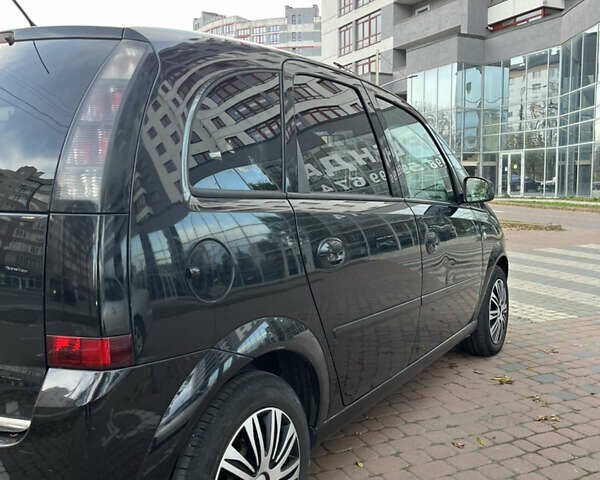 Черный Опель Мерива, объемом двигателя 1.6 л и пробегом 255 тыс. км за 4199 $, фото 5 на Automoto.ua