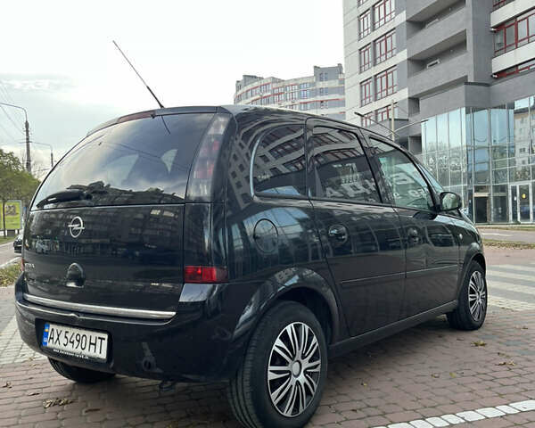 Черный Опель Мерива, объемом двигателя 1.6 л и пробегом 255 тыс. км за 4199 $, фото 6 на Automoto.ua