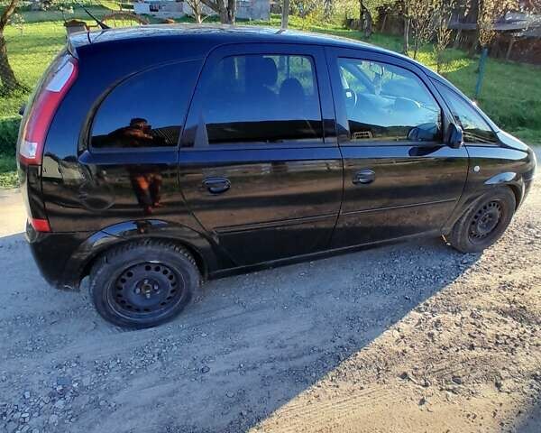 Черный Опель Мерива, объемом двигателя 1.6 л и пробегом 136 тыс. км за 3100 $, фото 4 на Automoto.ua