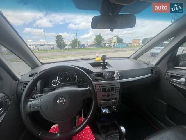 Черный Опель Мерива, объемом двигателя 1.8 л и пробегом 176 тыс. км за 4600 $, фото 6 на Automoto.ua