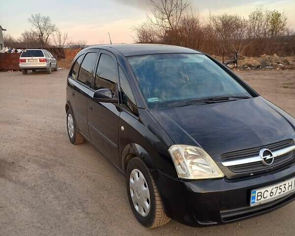 Черный Опель Мерива, объемом двигателя 1.69 л и пробегом 270 тыс. км за 2600 $, фото 7 на Automoto.ua