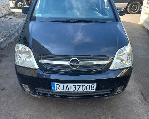Черный Опель Мерива, объемом двигателя 1.7 л и пробегом 208 тыс. км за 3000 $, фото 3 на Automoto.ua
