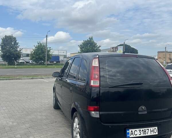 Черный Опель Мерива, объемом двигателя 1.8 л и пробегом 176 тыс. км за 4600 $, фото 4 на Automoto.ua