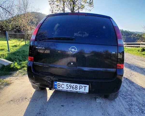 Черный Опель Мерива, объемом двигателя 1.6 л и пробегом 136 тыс. км за 3100 $, фото 1 на Automoto.ua