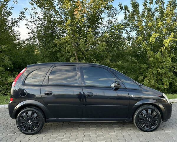 Черный Опель Мерива, объемом двигателя 1.6 л и пробегом 225 тыс. км за 4600 $, фото 3 на Automoto.ua