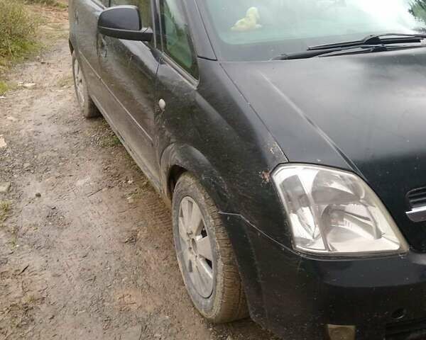 Черный Опель Мерива, объемом двигателя 1.69 л и пробегом 240 тыс. км за 2800 $, фото 4 на Automoto.ua