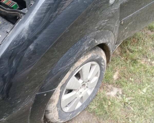 Черный Опель Мерива, объемом двигателя 1.69 л и пробегом 240 тыс. км за 2800 $, фото 11 на Automoto.ua