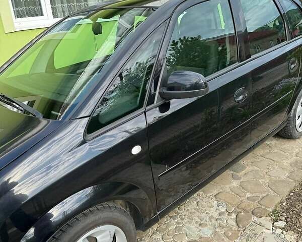 Черный Опель Мерива, объемом двигателя 1.6 л и пробегом 138 тыс. км за 3700 $, фото 5 на Automoto.ua
