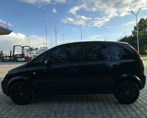 Черный Опель Мерива, объемом двигателя 1.6 л и пробегом 225 тыс. км за 4600 $, фото 6 на Automoto.ua
