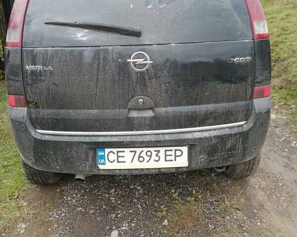 Черный Опель Мерива, объемом двигателя 1.69 л и пробегом 240 тыс. км за 2800 $, фото 1 на Automoto.ua