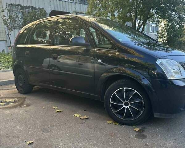 Черный Опель Мерива, объемом двигателя 1.6 л и пробегом 228 тыс. км за 4500 $, фото 4 на Automoto.ua