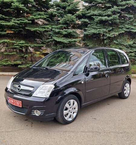 Черный Опель Мерива, объемом двигателя 1.6 л и пробегом 245 тыс. км за 5500 $, фото 1 на Automoto.ua