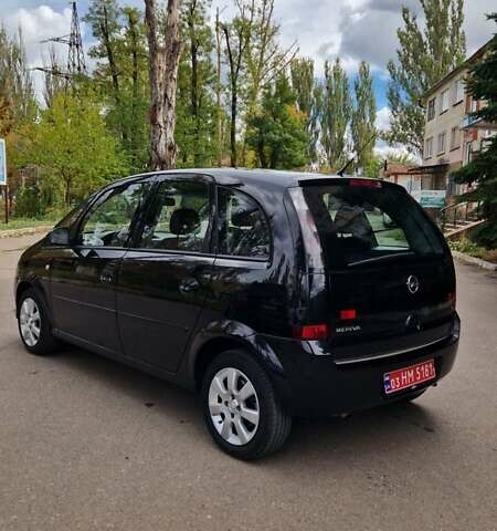 Черный Опель Мерива, объемом двигателя 1.6 л и пробегом 245 тыс. км за 5500 $, фото 5 на Automoto.ua
