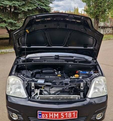 Черный Опель Мерива, объемом двигателя 1.6 л и пробегом 245 тыс. км за 5500 $, фото 8 на Automoto.ua