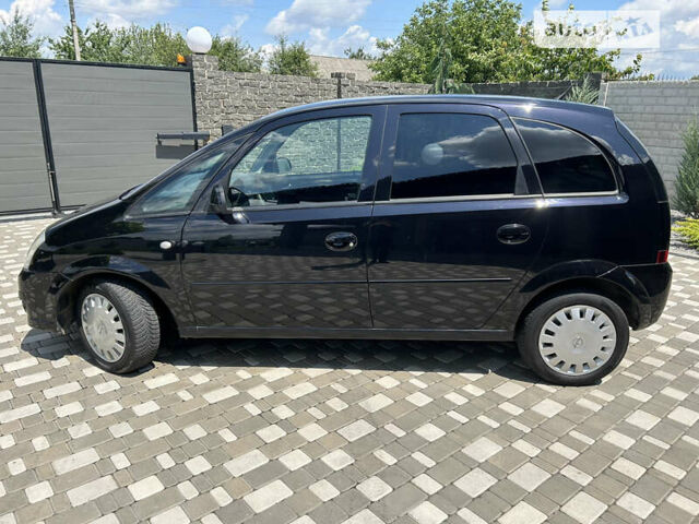 Опель Меріва 2006 у Полтаві на Automoto.ua Чорний Опель Меріва, об'ємом двигуна 1.6 л та пробігом 201 тис. км за 4999 $, фото 15 на Automoto.ua