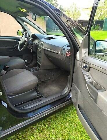 Черный Опель Мерива, объемом двигателя 1.3 л и пробегом 134 тыс. км за 4500 $, фото 7 на Automoto.ua