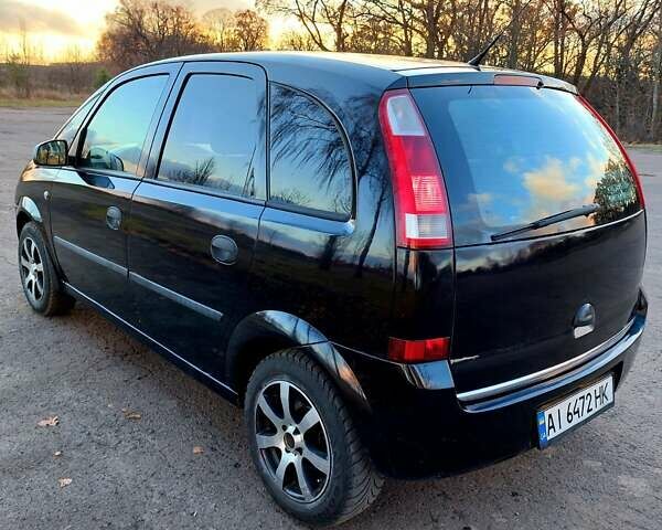 Черный Опель Мерива, объемом двигателя 1.6 л и пробегом 280 тыс. км за 4300 $, фото 7 на Automoto.ua