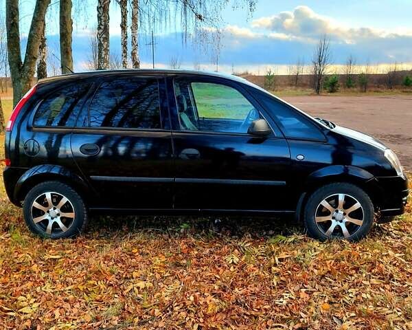 Черный Опель Мерива, объемом двигателя 1.6 л и пробегом 280 тыс. км за 4300 $, фото 16 на Automoto.ua