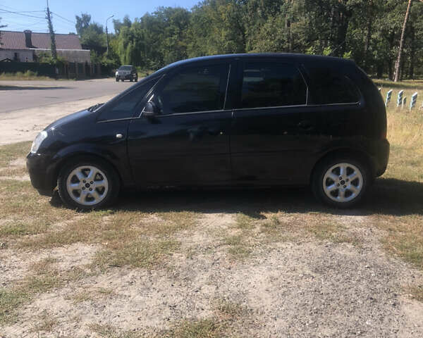 Черный Опель Мерива, объемом двигателя 1.6 л и пробегом 248 тыс. км за 3999 $, фото 1 на Automoto.ua