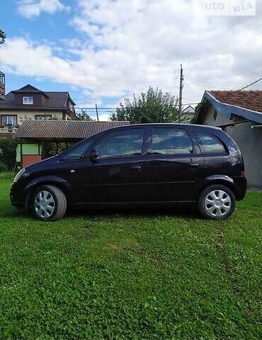 Черный Опель Мерива, объемом двигателя 1.3 л и пробегом 134 тыс. км за 4500 $, фото 1 на Automoto.ua
