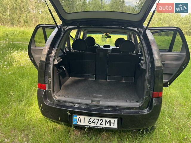 Черный Опель Мерива, объемом двигателя 1.4 л и пробегом 243 тыс. км за 2700 $, фото 3 на Automoto.ua