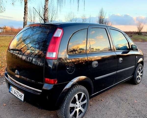 Черный Опель Мерива, объемом двигателя 1.6 л и пробегом 280 тыс. км за 4300 $, фото 44 на Automoto.ua