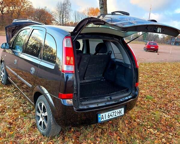 Черный Опель Мерива, объемом двигателя 1.6 л и пробегом 280 тыс. км за 4300 $, фото 42 на Automoto.ua