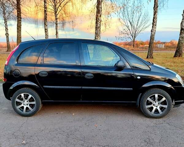 Черный Опель Мерива, объемом двигателя 1.6 л и пробегом 280 тыс. км за 4300 $, фото 6 на Automoto.ua
