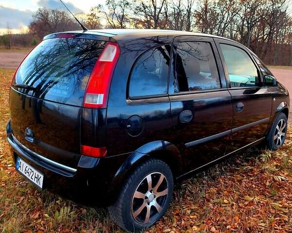 Черный Опель Мерива, объемом двигателя 1.6 л и пробегом 280 тыс. км за 4300 $, фото 3 на Automoto.ua
