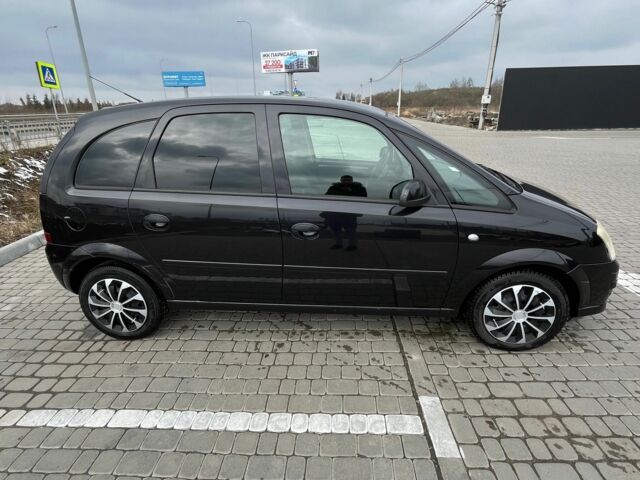 Черный Опель Мерива, объемом двигателя 1.8 л и пробегом 137 тыс. км за 4650 $, фото 1 на Automoto.ua