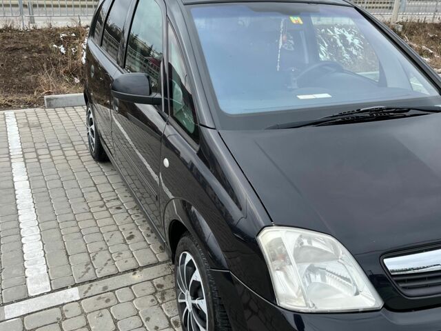 Черный Опель Мерива, объемом двигателя 1.8 л и пробегом 137 тыс. км за 4650 $, фото 4 на Automoto.ua